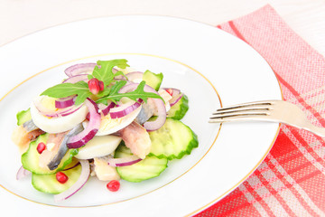 Dietary Food: Salad with Herring, Cucumber, Egg and Onion. 