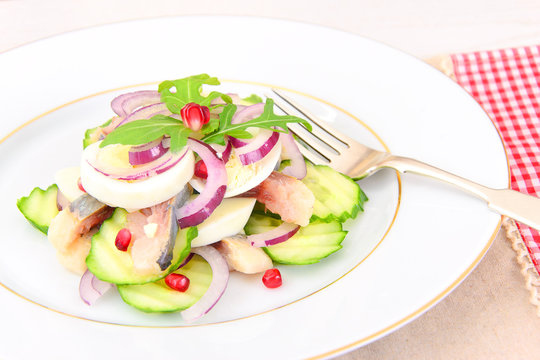 Dietary Food: Salad with Herring, Cucumber, Egg and Onion. 
