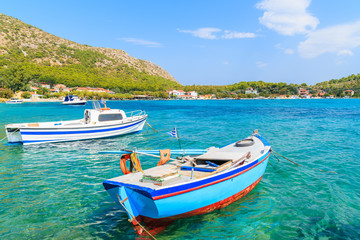 Obraz na płótnie Canvas Greek fishing boats on turquoise sea water in Posidonio bay, Samos island, Greece