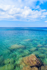 Fototapeta na wymiar Crystal clear sea water of Aegean Sea at Kokkari beach, Samos island, Greece