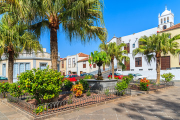 Fototapeta na wymiar Square with tropical plants and typical Canary style buildings in Garachico old town, Tenerife, Canary Islands, Spain