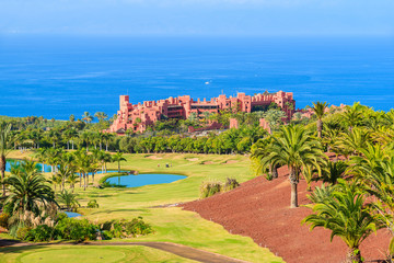 A view of luxury hotel which is located on a golf course in tropical gardens on Tenerife, Canary...