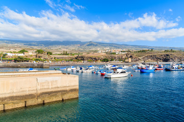 Fototapeta na wymiar Boats in San Juan port with mountains in background, Tenerife, Canary Islands, Spain