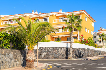 Fototapeta premium Yellow building with holiday apartments in San Juan town, Tenerife, Canary Islands, Spain