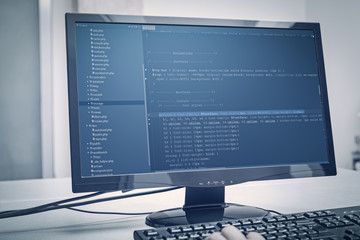 developer working on source codes on computer at office