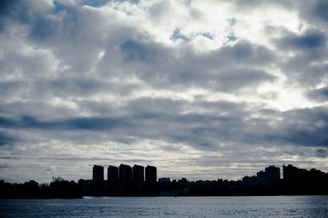 Turning the big river. Far away, backlit, you can see the city.
