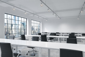 Workplaces in a bright modern loft open space office. Empty tables and docents' book shelves. New York panoramic view. A concept of a high quality consulting services. 3D rendering.
