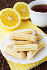 Homemade lemon churros (finger biscuits) with cup of tea