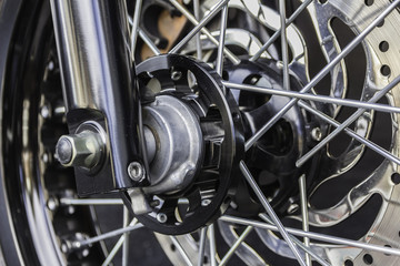 Fototapeta na wymiar Motorcycle wheel in black and white with ABS brakes.