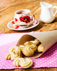Homemade cookies with cup of hot chocolate on wooden table