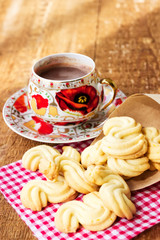Homemade cookies with cup of hot chocolate on wooden table