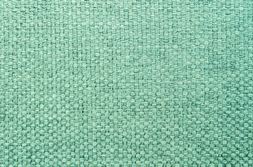 Closeup green fabric at sofa texture background