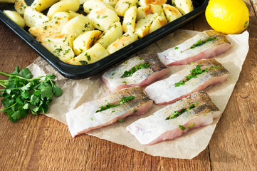 Preparation of fish dish - fish fillet with baked potatoes