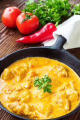 Chicken cooked in paprika and cream sauce, with ingredients