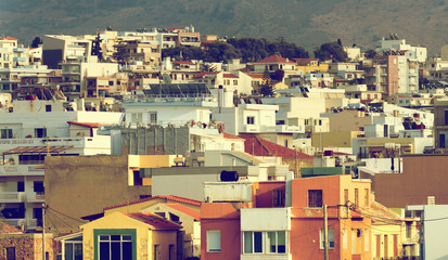 View of many rooftops in city.