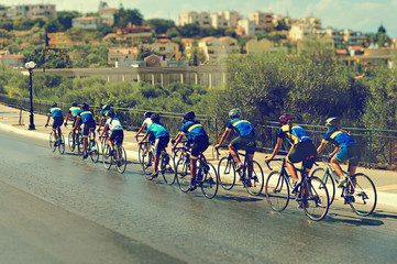 Cyclists during the race on city street.