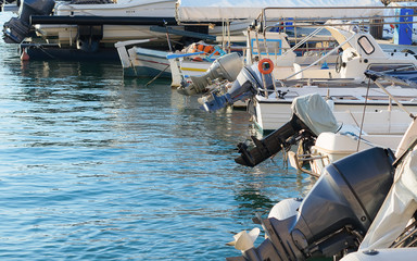 Fototapeta na wymiar Several motor boats moored at the dock.