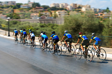 Cyclists during the race on city street.
