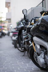 Obraz na płótnie Canvas Black sport motorcycle parked on the parking lot.