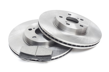 brake discs and brake pads on a white background. car parts