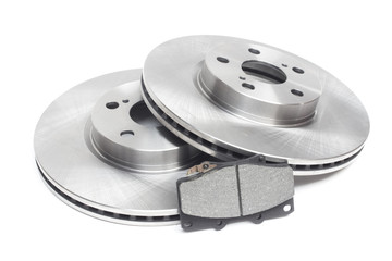 brake discs and brake pads on a white background. car parts
