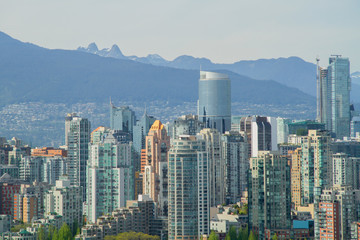 Vancouver and Mountains / Looking north towards the city of Vancouver.  North shore mountains can been in background.  The two peaks to the left are called the lions.