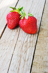 Fresh strawberries on wooden background