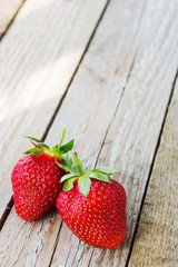 Fresh strawberries on wooden background