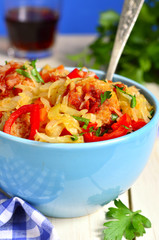 Cabbage stewed with chicken meatballs in tomato sauce.