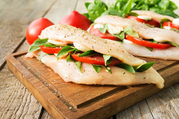 Raw chicken breasts stuffed with vegetables