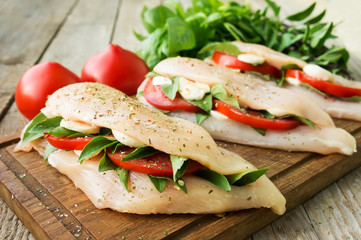Raw chicken breasts stuffed with vegetables