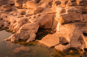 Fototapeta na wymiar Dog Head at Sam-Pan-Bok Grand Canyon , Amazing of rock hole ston