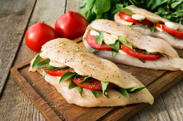 Raw chicken breasts stuffed with vegetables