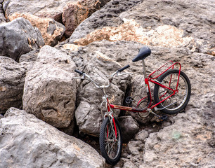 Old bicycle on rocks