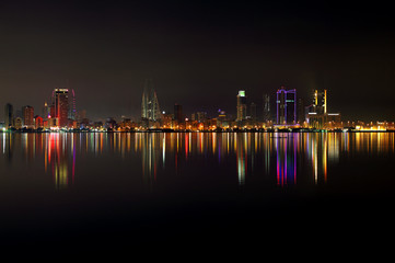 Fototapeta na wymiar A beautiful view of Bahrain skyline during night and its reflect
