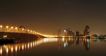 Fototapeta na wymiar A beautiful view of Bahrain skyline during night and its reflect