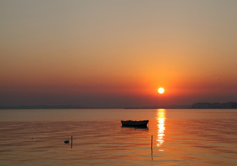 Silhouette  of a boat during sunrise