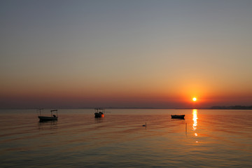 Boats harbored at Busaiteen beach during dawn