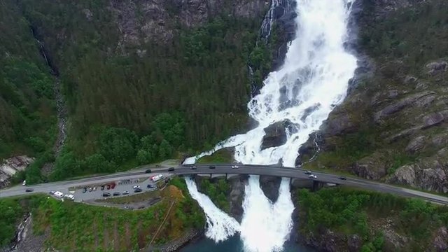 Aerial footage traffic on the bridge above the Langfossen waterfall in Norway, popular tourist attraction. Aerial 4k Ultra HD.
