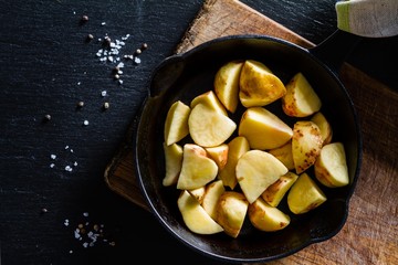 Raw potato slices with herbs, spices