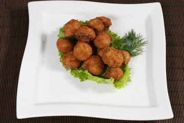 fried meatballs in lettuce leaf