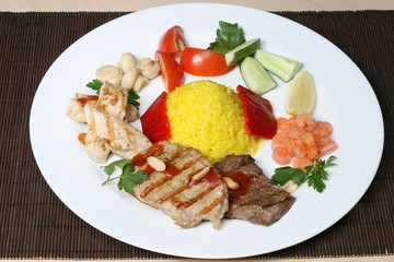 several kinds of meat with rice and vegetables