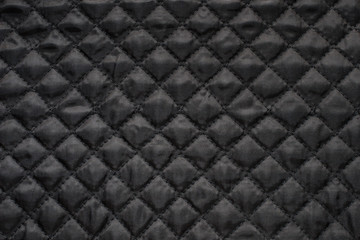 Close-up of black quilted fabric