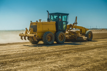 Grader in Leveling soil for construction project in Iraqi desert