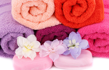 Fototapeta na wymiar Towels, flowers and soaps
