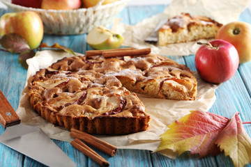 Homemade apple cake on blue wooden table