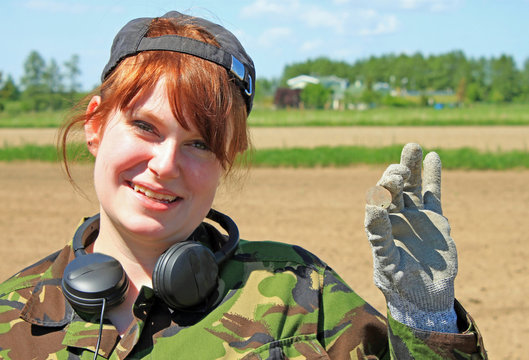 Woman With A Metal Detector Searching In A Field. Treasure Hunters. 