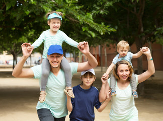 Smiling family with three kids