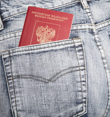 The Russian passport in a hip-pocket of jeans