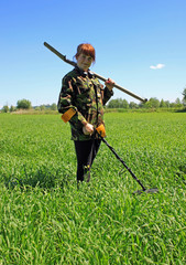 Girl with metal detector. Treasure hunter